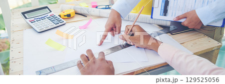 Banner Two businesspeople meeting work at office desk. Teamwork partners team with Business strategy chart graph, infographic financial report. Team partner planning excel stat report with copy space Banner Two businesspeople meeting work at office desk. Teamwork partners team with Business strategy chart graph, infographic financial report. Team partner planning excel stat report with copy space 129525056