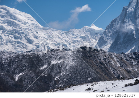 Beautiful view of snowcapped mountains seen from Tsergo Ri viewpoint in Langtang valley, Nepal. It is located in a mountain range of the Jugal Himal in the Central Himalayas. 129525317