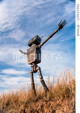 Robot on a background of blue sky 129525362