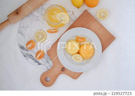 Homemade Citrus Pudding with Lemonade in Background 129527723