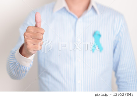 man with blue Ribbon for concept of blue November, November Prostate Cancer Awareness month, World Diabetes day , Men Health month, International men, Father day. Healthcare and world cancer day 129527845