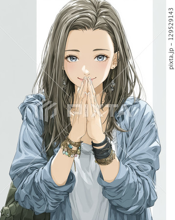 顔の前で両手を合わせて誠実にお願いする若いビジネスウーマン 129529143