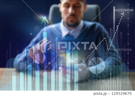 Business professional analyzes financial data in a modern office setting during the day using digital charts for better decision making Business professional analyzes financial data in a modern office setting during the day using digital charts for better decision making 129529670