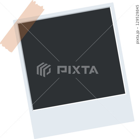 Classic white-framed picture with blank space. A vintage photo is stuck to a surface with a strip of tape. 129529845