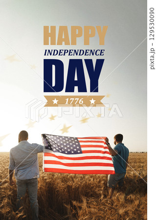 Celebrating Independence Day with pride in an open field while holding an American flag at sunset Celebrating Independence Day with pride in an open field while holding an American flag at sunset 129530090