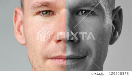 Portrait of a man showcasing a split-tone effect with one side in color and the other in black and white Portrait of a man showcasing a split-tone effect with one side in color and the other in black and white 129530578