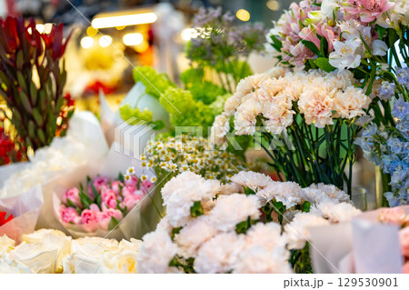 Colorful flower display at a local market showcasing seasonal blooms and fresh arrangements during the spring season 129530901
