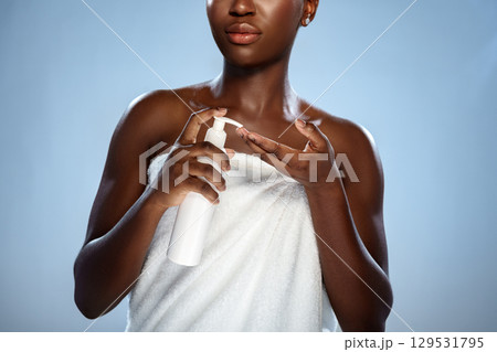 Woman applying skincare product with focus on skincare routine and self-care in a calm setting Woman applying skincare product with focus on skincare routine and self-care in a calm setting 129531795
