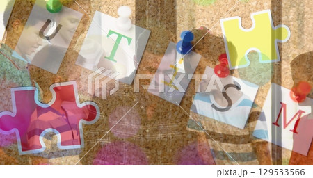 Image of puzzle and autism text over diverse schoolchildren smiling 129533566