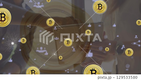 Image of bitcoins and social media icons over midsection of businesspeople using tablet Image of bitcoins and social media icons over midsection of businesspeople using tablet 129533580