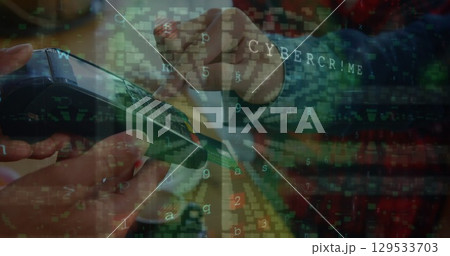 Image of cyber crime and padlock over hands of caucasian people using payment terminal 129533703