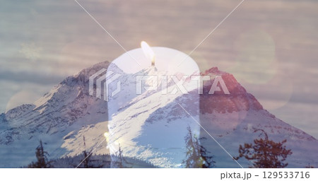 Image of candle over mountains landscape 129533716