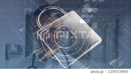 Image of data processing and padlock icon over caucasian male doctor 129533969