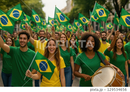 Group of diverse young Brazilians celebrating on the street with flags and drums 129534656