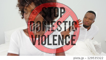 Image of stop domestic violence text over african american couple arguing Image of stop domestic violence text over african american couple arguing 129535322