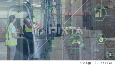 Image of tech icons in hexagons over caucasian female and male warehouse workers Image of tech icons in hexagons over caucasian female and male warehouse workers 129535558