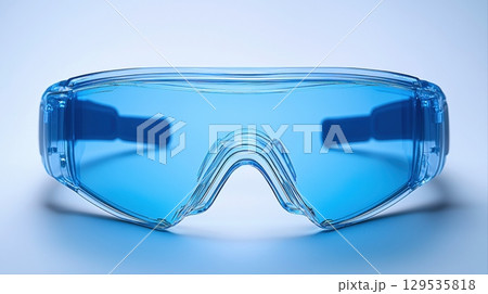Bright blue protective goggles are displayed against light background ideal for safeguarding eyes during sports construction or laboratory tasks. Their stylish design complements practical use. Bright blue protective goggles are displayed against light background ideal for safeguarding eyes during sports construction or laboratory tasks. Their stylish design complements practical use. 129535818