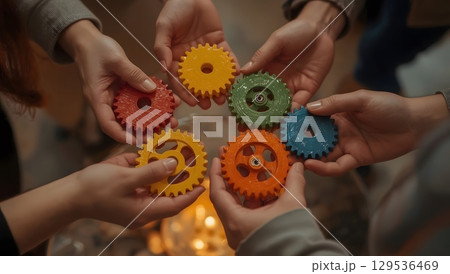 Teamwork in Action: Colorful Interlocking Gears Teamwork in Action: Colorful Interlocking Gears 129536469