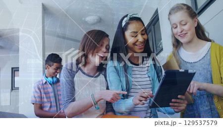 Image of financial graph over happy diverse girls using tablet at school 129537579