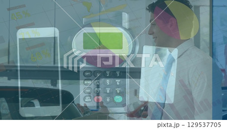 Image of data processing over calculator and caucasian businessman smiling 129537705