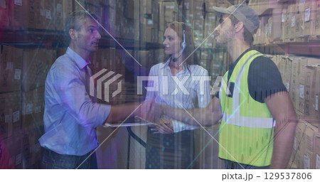 Image of caucasian female and male warehouse worker moving shapes 129537806
