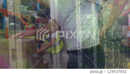 Image of green dots moving over midsection of caucasian male warehouse worker having back pain 129537832