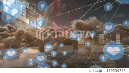 Image of network of connections over clouds and fit african american man doing push ups 129539733