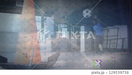 Image of network of connections over clouds and african american man kicking ball Image of network of connections over clouds and african american man kicking ball 129539738