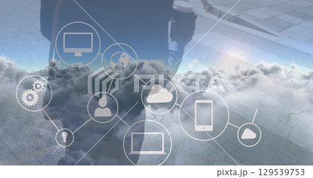 Image of network of connections over clouds and midsection of african american businessman Image of network of connections over clouds and midsection of african american businessman 129539753