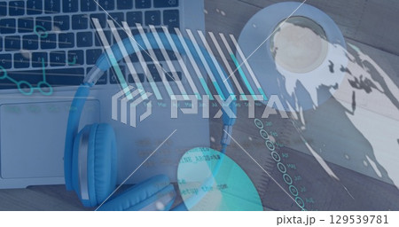 Image of financial graph over laptop on desk 129539781