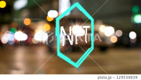 Image of nft logo over defocussed people and traffic on city street at night Image of nft logo over defocussed people and traffic on city street at night 129539839