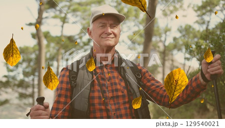 Image of falling leaves over caucasian senior man walking Image of falling leaves over caucasian senior man walking 129540021