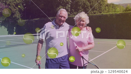 Image of falling tennis ball over caucasian senior couple on the tennis court Image of falling tennis ball over caucasian senior couple on the tennis court 129540024