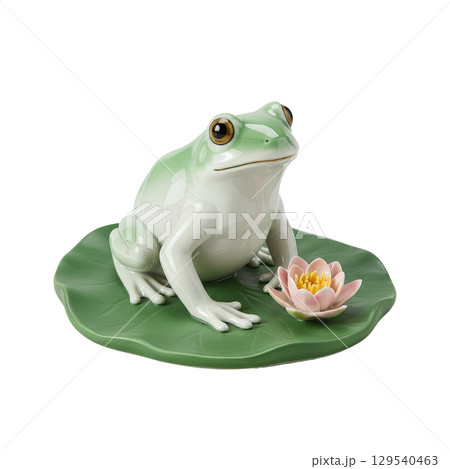 Elegant porcelain frog figurine resting on a green lily pad with a delicate pink lotus flower 129540463
