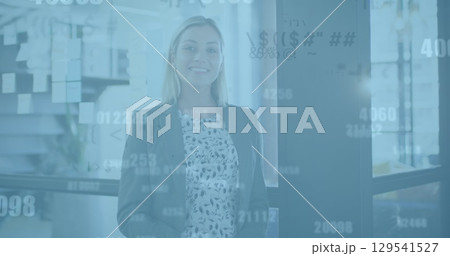 Image of data processing over caucasian businesswoman using smartphone in office 129541527