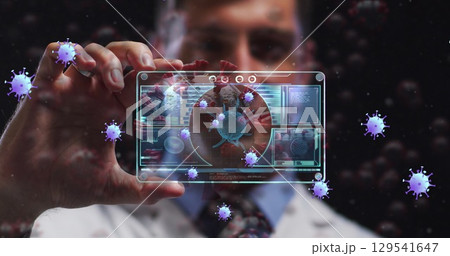 Image of purple virus cell over caucasian male lab worker with digital card with virus data Image of purple virus cell over caucasian male lab worker with digital card with virus data 129541647