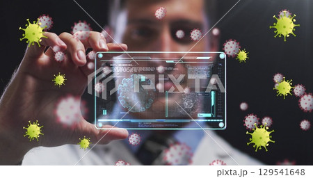 Image of virus yellow cells over caucasian male doctor with digital card with virus data Image of virus yellow cells over caucasian male doctor with digital card with virus data 129541648