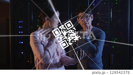 Image of digital data processing and qr code over two diverse server room workers Image of digital data processing and qr code over two diverse server room workers 129542378
