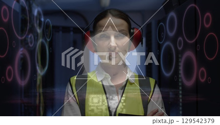 Image of digital data processing and qr code over caucasian female server room worker Image of digital data processing and qr code over caucasian female server room worker 129542379