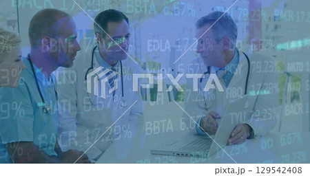 Image of data processing over group of diverse doctors Image of data processing over group of diverse doctors 129542408