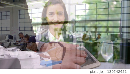 Image of person caucasian man using tablet over smiling caucasian woman Image of person caucasian man using tablet over smiling caucasian woman 129542421