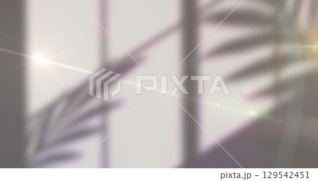 Image of glowing yellow lights over shadows on white background Image of glowing yellow lights over shadows on white background 129542451