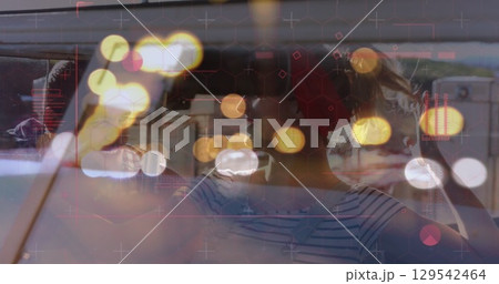 Image of digital data processing over two caucasian people in car 129542464