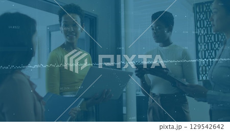 Image of financial data processing over diverse business people in office Image of financial data processing over diverse business people in office 129542642