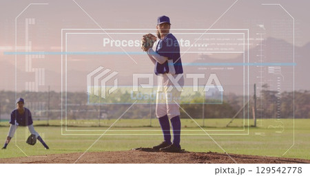 Image of world map and processing over rugby player holding over sports stadium Image of world map and processing over rugby player holding over sports stadium 129542778