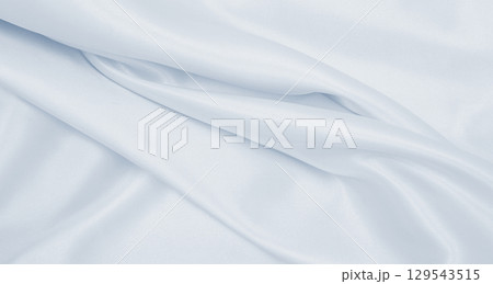 Smooth elegant grey silk or satin luxury cloth as wedding background. Luxurious background design 129543515