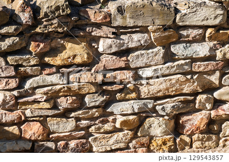 Backgrounds of the old stone wall. 129543857