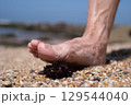 Foot Almost Stepped on a Sea Urchin 129544040