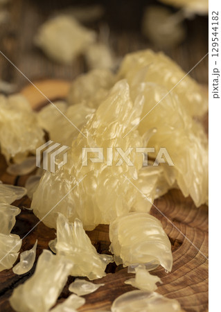 sweet sliced peeled citrus, delicious fresh citrus on a wooden board, close up sweet sliced peeled citrus, delicious fresh citrus on a wooden board, close up 129544182
