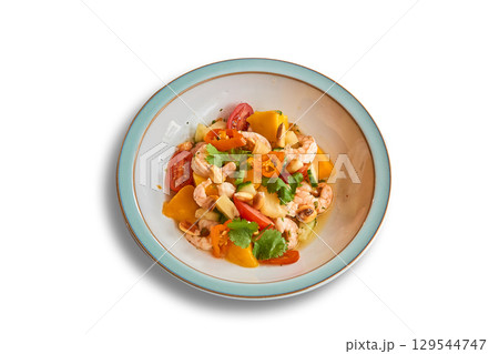 Ceviche pineapple, Mango and shrimps in bowl isolated on white Ceviche pineapple, Mango and shrimps in bowl isolated on white 129544747